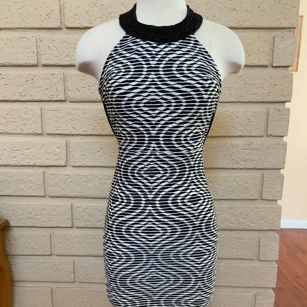 New midi dress open back neck line decorated with beads